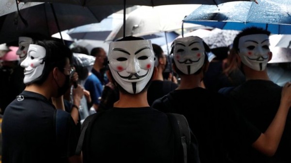 
                              Hong Kong: Violence flares again as pro-democracy protesters defy mask ban 
                      